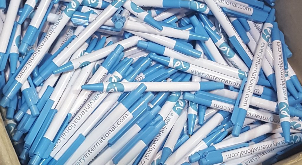everyinternational.com and logo printed on blue pens