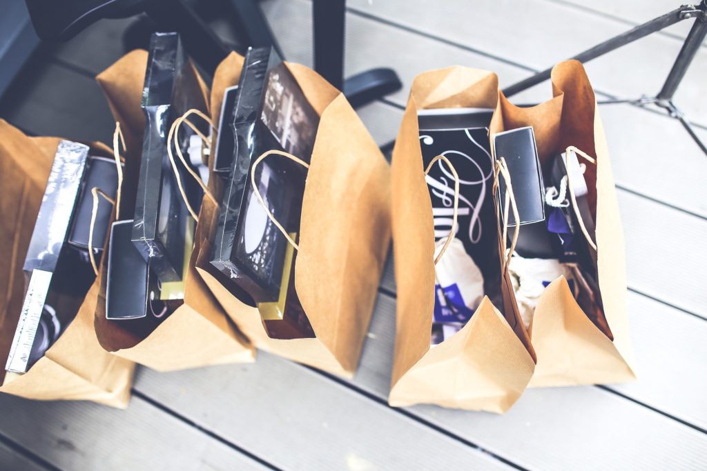medium sized brown gift bags lined up filled with products